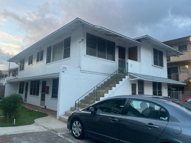 a house with a car parked in front of it